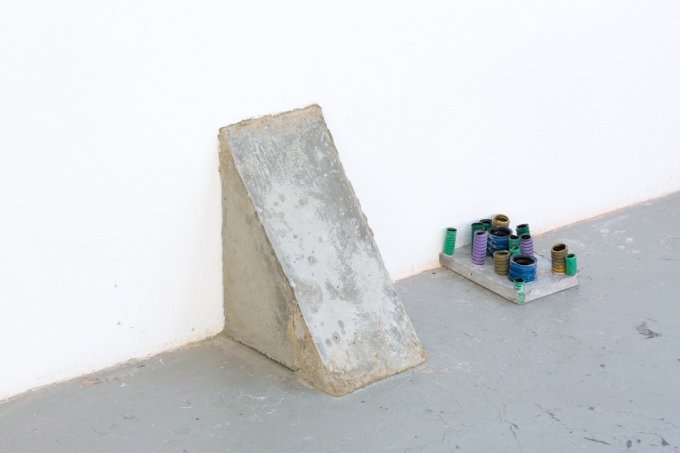 Left: Antonio Della Corte – Permanent – Concrete – 25x30x17cm, 2019 Right: Antonio Della Corte - Moltitude (landscape) -Plastic pipes, acrilic, concrete. 20x15x10cm 2018