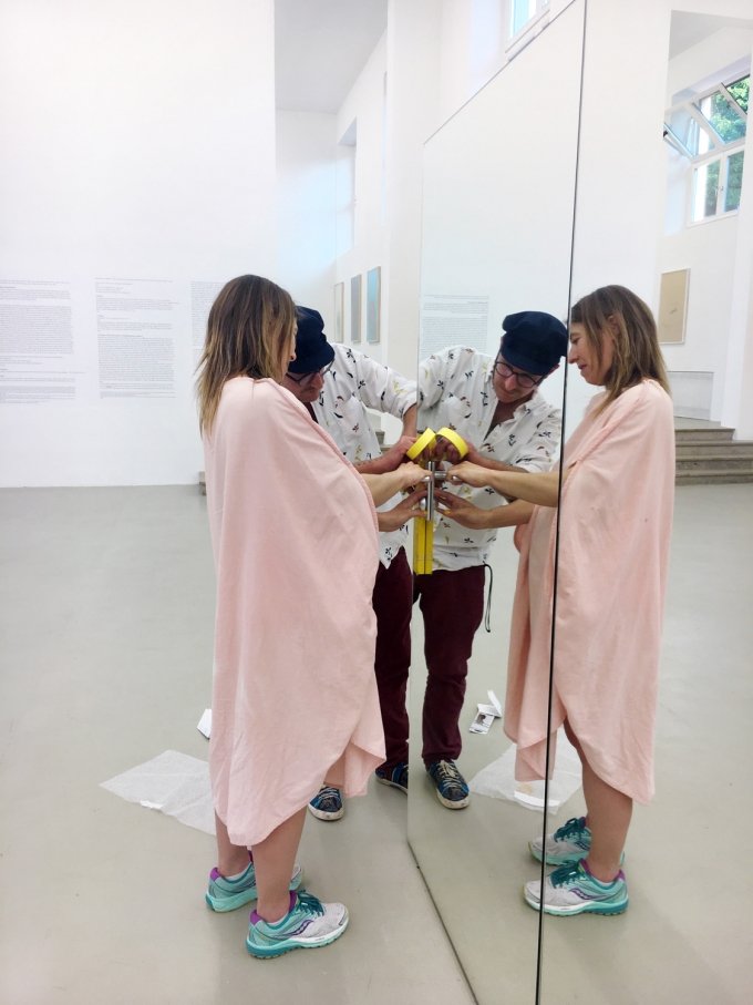 The mirrored wall, Mirror (2019), got a door handle during a late and rather boring and brief	performative gesture on June 7th, as part of the event Wine gets depressed at times, which	featured concerts by Trevor Lee Larson and Battle-ax, as well as a presentation by Westphalie,	including a performance by Holzer and the artist and publisher David Jourdan. The artist chose	glue over drilling or cutting.